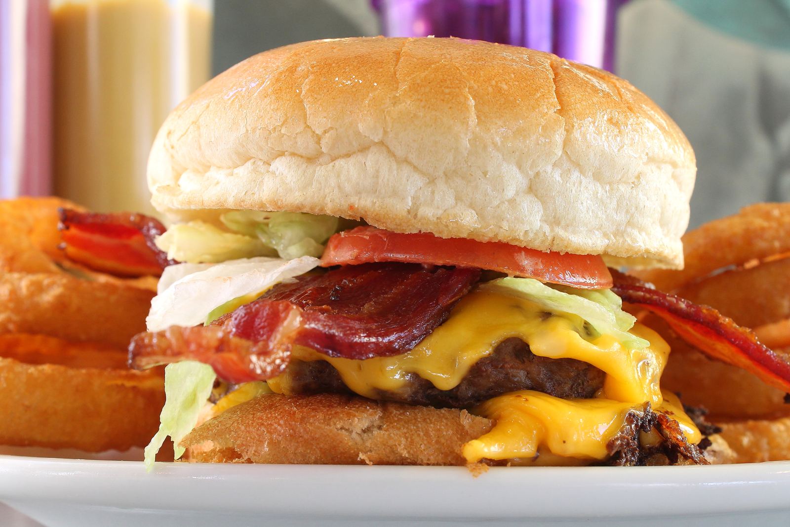 Bacon cheeseburger with onion rings at Bogey's