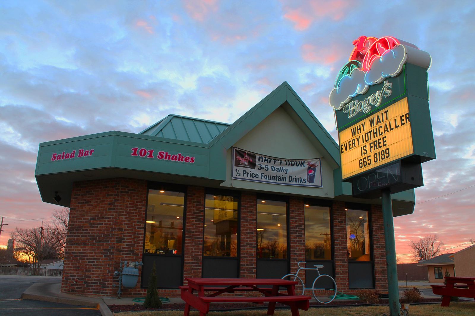 The Bogey's building and neon sign at sunset on Plum Street